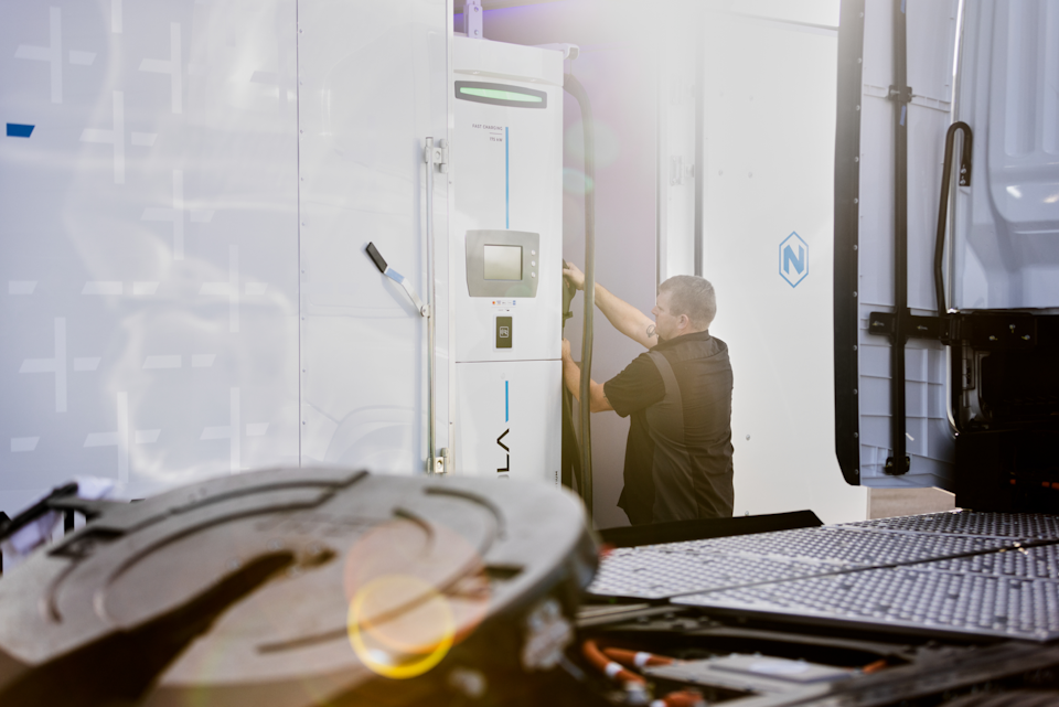 A man working with a charging station.