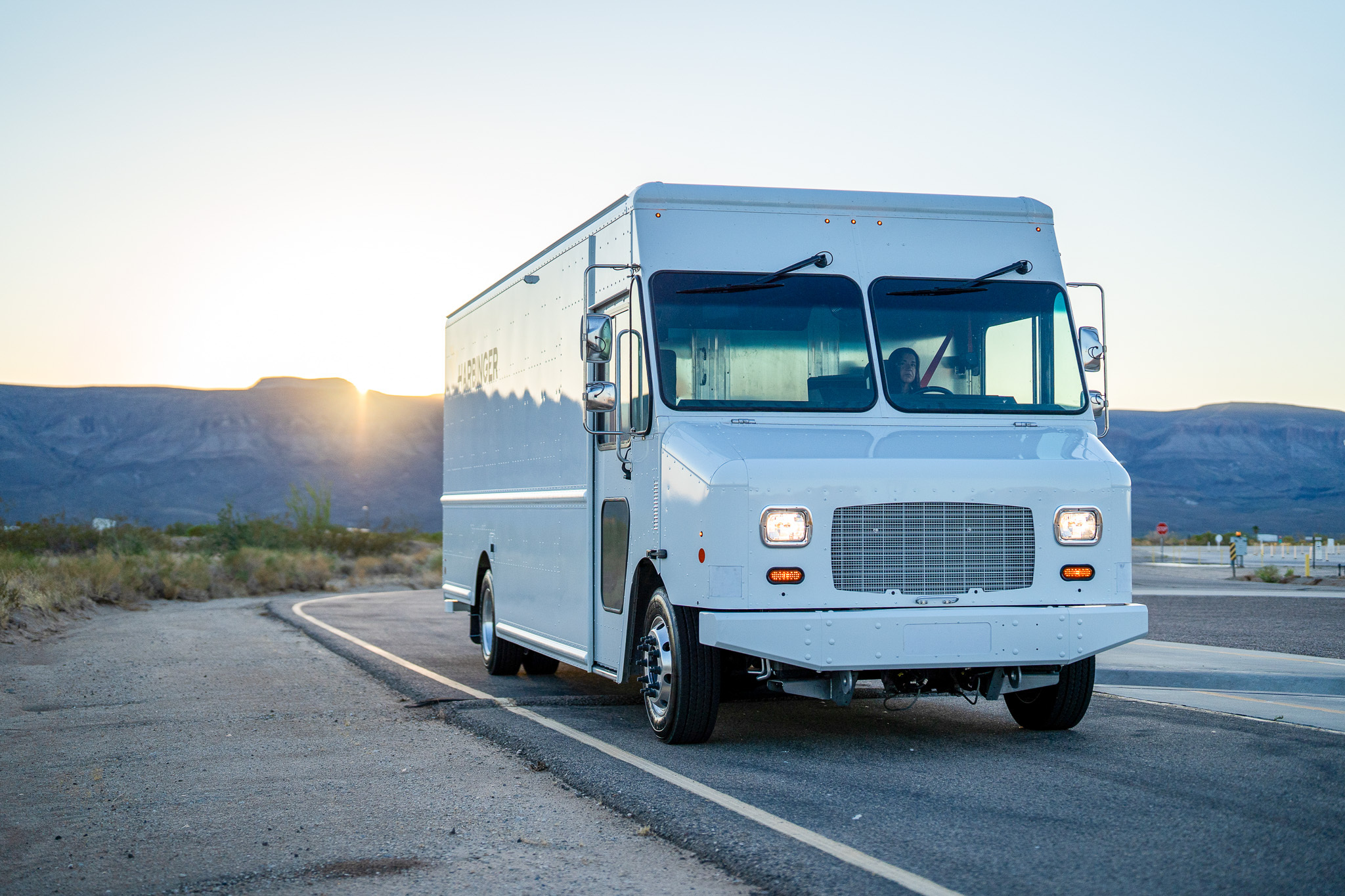 A white hybrid step van